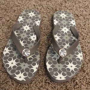 Grey and white Coach flip flops. Worn once.